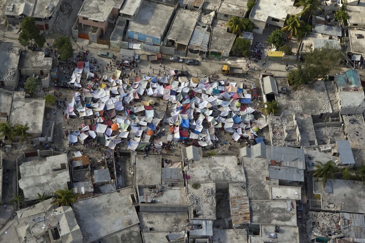 Haitians set up impromtu tent cities through the capital after an earthquake measuring 7 plus on the Richter scale rocked Port au Prince Haiti just before 5 pm yesterday, January 12, 2010.